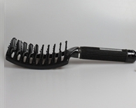 Black handheld brush for untangling hair knots